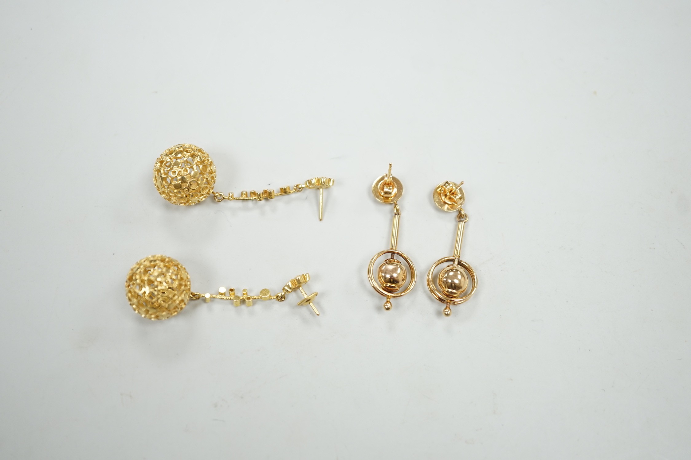 A modern pair of pierced 9ct gold globe drop earrings, 47mm and one other pair of 9ct drop earrings, 17.1 grams.